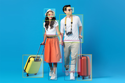 Young couple going for holidays with colorful suitcases